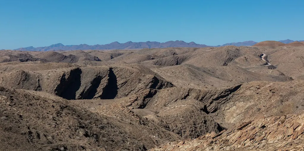 Elevated view across the dunes and open landscape of the Namib Desert